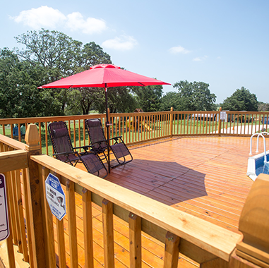 Peaceful RV sites surrounded by trees at Queen & Duke RV Resort in Whitesboro, Texas